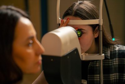 close-up in an ophthalmology clinic The girls inserted the lens and looked at the bottom of the eye